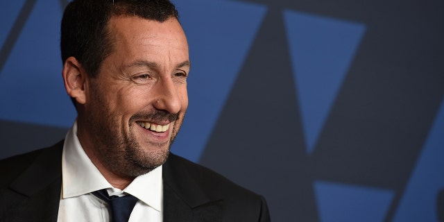 FILE - Adam Sandler arrives at the Governors Awards on Oct. 27, 2019, at the Dolby Ballroom in Los Angeles.