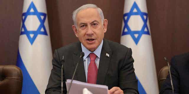 Israeli Prime Minister Benjamin Netanyahu attends the weekly cabinet meeting at the prime minister's office in Jerusalem on March 19, 2023. Netanyahu's government repealed a 2005 act that led to Israeli forces withdrawing from the occupied West Bank.