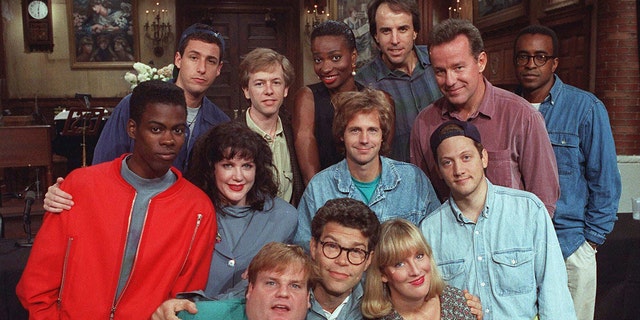FILE - The cast of NBC's "Saturday Night Live" pose on set of the show in New York, September 22, 1992. Left to right, front row; Chris Farley, Al Franken and Melanie Hutsell. Middle, from left: Chris Rock, Julia Sweeney, Dana Carvey and Rob Schneider. Back row, left to right: Adam Sandler, David Spade, Ellen Cleghorne, Kevin Nealon, Phil Hartman and Tim Meadows.