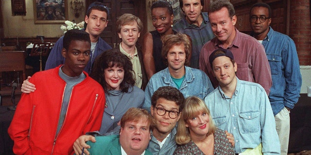 FILE - The cast of NBC's "Saturday Night Live" pose on the show's set in New York, Sept. 22, 1992. From left, front row; Chris Farley, Al Franken and Melanie Hutsell. In middle row, from left: Chris Rock, Julia Sweeney, Dana Carvey and Rob Schneider. In back row, from left: Adam Sandler, David Spade, Ellen Cleghorne, Kevin Nealon, Phil Hartman and Tim Meadows.