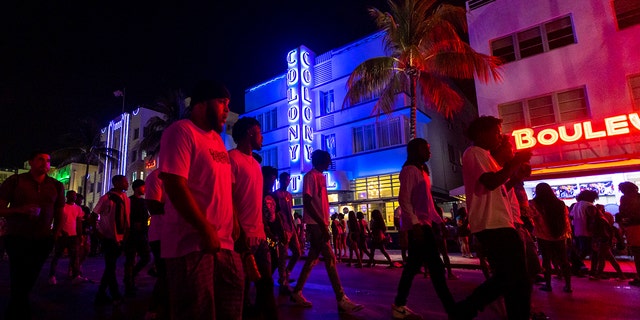 Crowds walk up and down Ocean Drive during spring break on Saturday, March 18, 2023, in Miami Beach, Fla. 