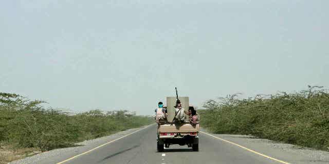 Saudi-backed forces are pictured in a vehicle in Hodeida, Yemen, on Feb. 12, 2018. Yemen’s warring sides have agreed to release nearly 900 prisoners of war in a United Nations-brokered deal.