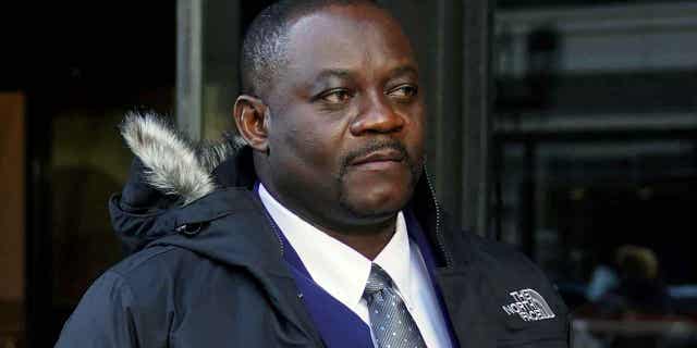 Former Haitian Mayor Jean Morose Viliena departs federal court on March 20, 2023, in Boston. Viliena has been criminally charged with lying on his application to become a United States citizen.