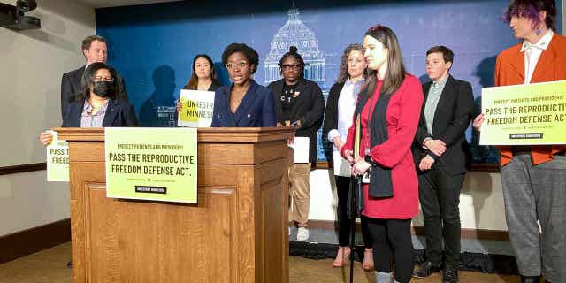 Democratic Minnesota state Rep. Esther Agbaje speaks at a news conference on Monday, March 20, 2023, in St. Paul, Minnesota. The Minnesota House passed a bill to prohibit enforcement of laws, subpoenas, judgments or extradition requests from other states against people who get, perform or assist with abortions in Minnesota.