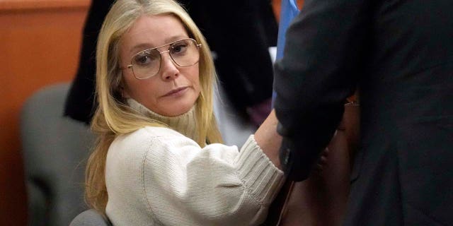 Gwyneth Paltrow wore a cream sweater and glasses for first court appearance related to 2016 ski incident.