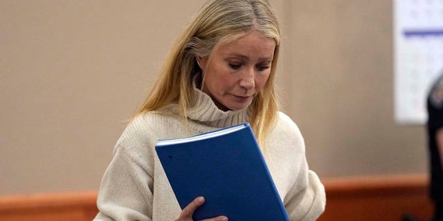 Gwyneth Paltrow carried a blue notebook while entering courtroom Tuesday in Utah.