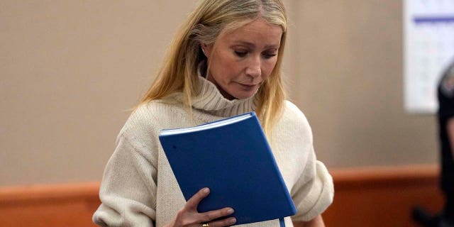 Gwyneth Paltrow carried a blue notebook while entering courtroom Tuesday in Utah.