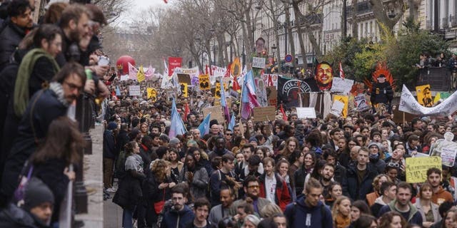 Protesters march during a rally in Paris, Thursday, March 23, 2023.
