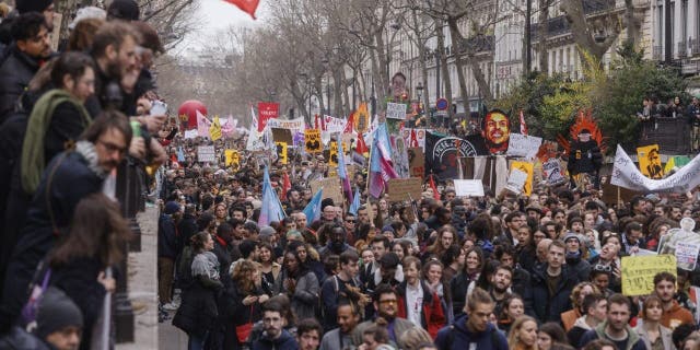 Protesters march during a rally in Paris, Thursday, March 23, 2023.