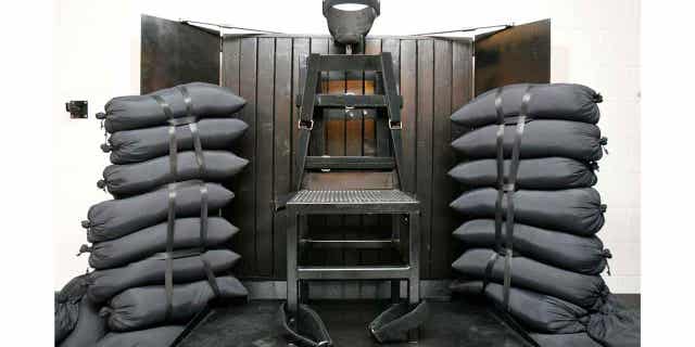 FILE - A chair sits in the execution chamber at the Utah State Prison on June 18, 2010, after Ronnie Lee Gardner was executed by firing squad in Draper, Utah.