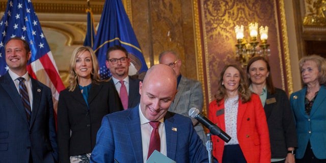 Gov. Spencer Cox signs two social media regulation bills during a ceremony at the Capitol building in Salt Lake City on Thursday, March 23, 2023.