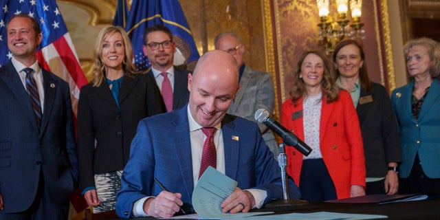 Gov. Spencer Cox signs two social media regulation bills during a ceremony at the Capitol building in Salt Lake City on Thursday, March 23, 2023.