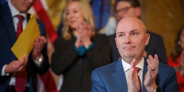 Gov. Spencer Cox applauds after signing two social media regulation bills during a ceremony at the Capitol building in Salt Lake City on Thursday, March 23, 2023. 