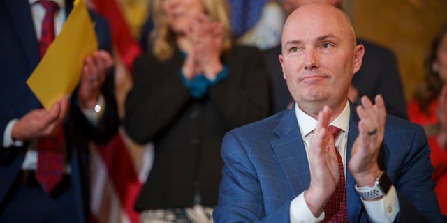 Gov. Spencer Cox applauds after signing two social media regulation bills during a ceremony at the Capitol building in Salt Lake City on Thursday, March 23, 2023.
