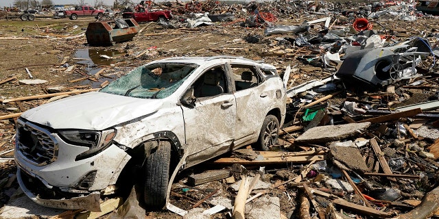 A vehicle awaits removal Saturday March 25, 2023, after getting destroyed by a Friday night tornado that hit Rolling Fork, Miss.  Emergency officials in Mississippi say several people have been killed by tornadoes that tore through the state on Friday night, destroying buildings and knocking out power as severe weather produced hail the size of golf balls moved through several southern states. 