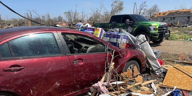 Debris covers the ground on Saturday in Silver City, Miss. Louisiana, Alabama and Georgia expected additional severe weather on Sunday. 
