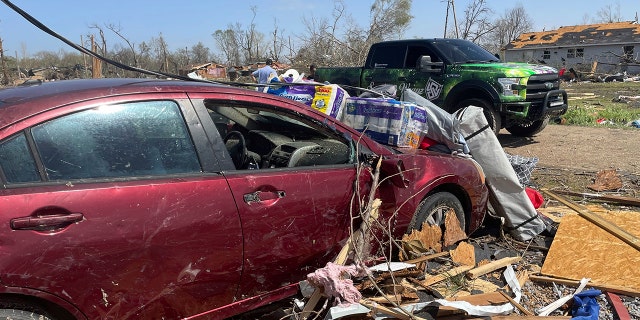 Debris covers the ground on Saturday in Silver City, Miss. Louisiana, Alabama and Georgia expected additional severe weather on Sunday. 