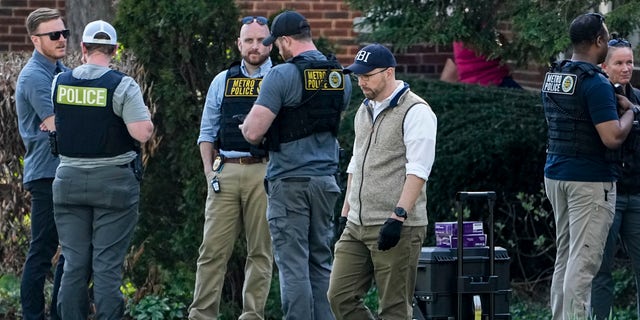 Authorities investigate a home possibly connected to the school shooting in Nashville, Monday, March 27, 2023, in Nashville, Tenn. Nashville police identified the victims in the private Christian school shooting Monday as three 9-year-old students and three adults in their 60s, including the head of the school. (AP Photo/John Bazemore)