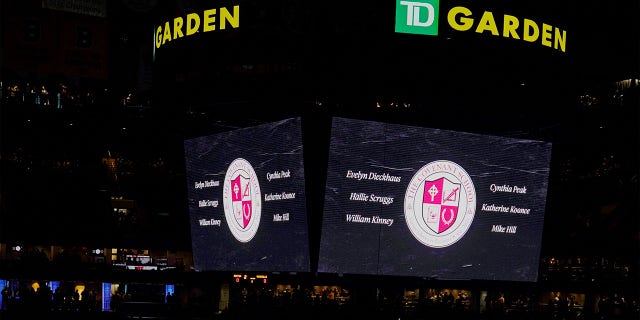 House lights are dimmed during a moment of silence for the victims of the Covenant School shooting before the game between the Nashville Predators and the Boston Bruins, Tuesday, March 28, 2023, in Boston.