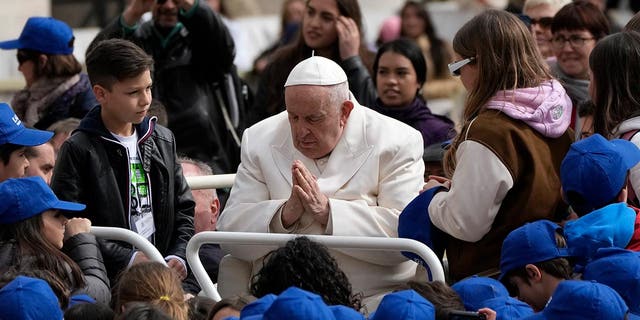 Pope Francis meets children at the end of his weekly general audience in St. Peter's Square at the Vatican, Wednesday, March 29, 2023. Pope Francis went to a hospital in Rome on Wednesday for some previously scheduled tests and slipped out of the Vatican after his general audience and ahead of the busy start of Holy Week this Sunday. 