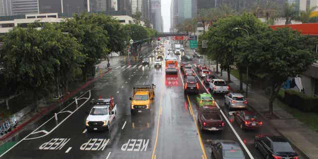 A storm brings a rainy morning commute through Los Angeles, California, on March 29, 2023.