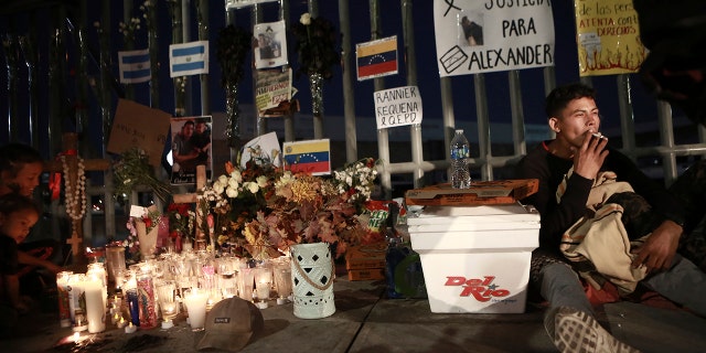 Activists and migrants join a vigil for the victims of a fire at a migration detention center in Ciudad Juarez, Mexico, March 29, 2023.