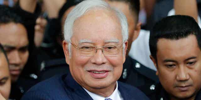 Former Malaysian Prime Minister Najib Razak gets into a car after appearing in court in Kuala Lumpur, Malaysia, on April 3, 2019. On March 31, 2023, the Supreme Court of Malaysia declined to review its decision to uphold Razak's graft conviction.