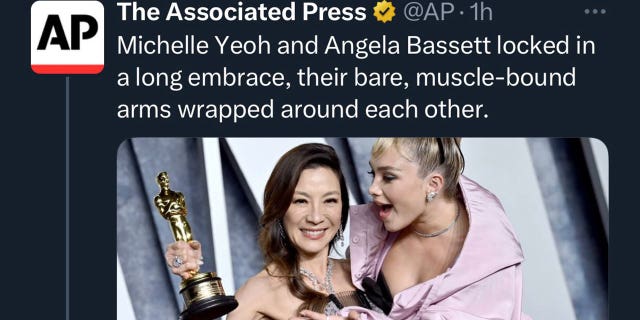 A deleted Associated Press tweet reading, "Michelle Yeoh and Angela Bassett locked in a long embrace, their bare, muscle-bound arms wrapped around each other."