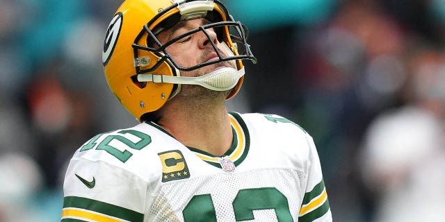 Miami Gardens, Florida, USA; Green Bay Packers quarterback Aaron Rodgers (12) reacts as he walks off the field after a failed third down conversion attempt during the first half against the Miami Dolphins at Hard Rock Stadium.
