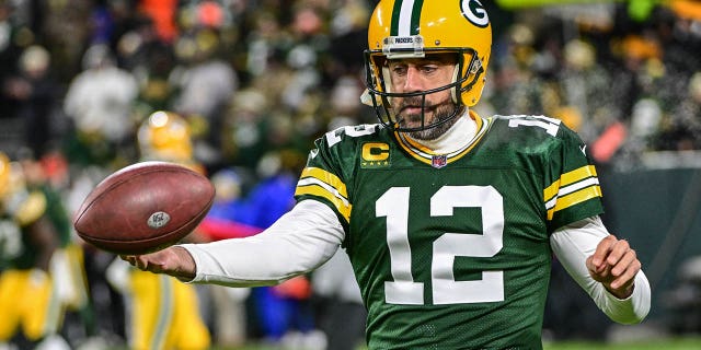 December 19, 2022; Green Bay, Wisconsin, USA; Green Bay Packers quarterback Aaron Rodgers (12) warms up before a game against the Los Angeles Rams at Lambeau Field.