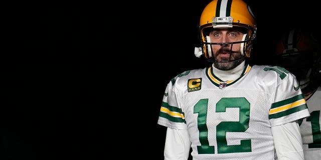 Green Bay Packers number 12 Aaron Rodgers walks onto the field before the game against the Tennessee Titans at Lambeau Field on November 17, 2022 in Green Bay, Wisconsin.