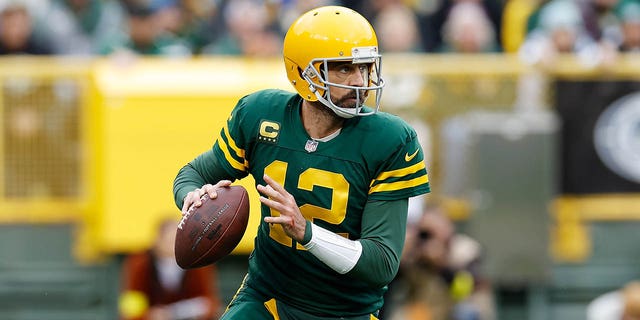 Aaron Rodgers, #12 of the Green Bay Packers, drops back to pass against the New York Jets at Lambeau Field on October 16, 2022 in Green Bay, Wisconsin.