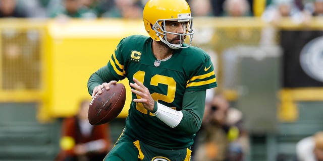 Aaron Rodgers, #12 of the Green Bay Packers, drops back to pass against the New York Jets at Lambeau Field on Oct. 16, 2022 in Green Bay, Wisconsin.
