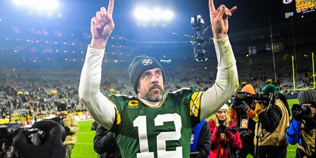 Quarterback Aaron Rodgers waves after the Packers defeated the Los Angeles Rams at Lambeau Field on Dec. 19, 2022, in Green Bay, Wisconsin.