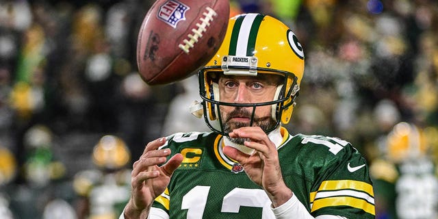 Packers quarterback Aaron Rodgers prepares for the Los Angeles Rams game on December 19, 2022 in Green Bay, Wisconsin.