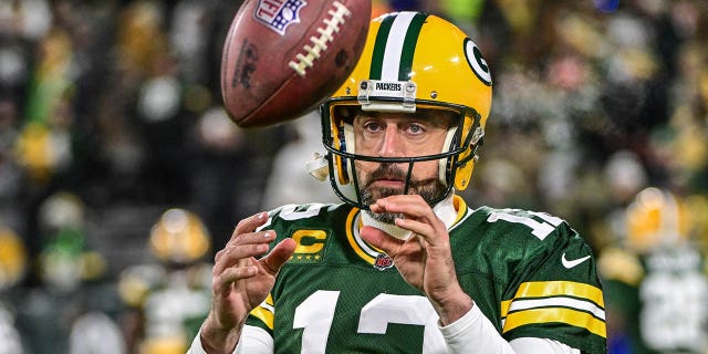 Packers quarterback Aaron Rodgers prepares for the Los Angeles Rams game on December 19, 2022 in Green Bay, Wisconsin.