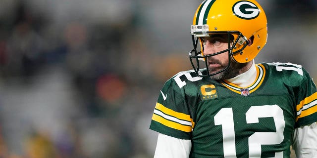 Green Bay Packers number 12 Aaron Rodgers warms up before a game against the Los Angeles Rams at Lambeau Field on December 19, 2022 in Green Bay, Wisconsin.