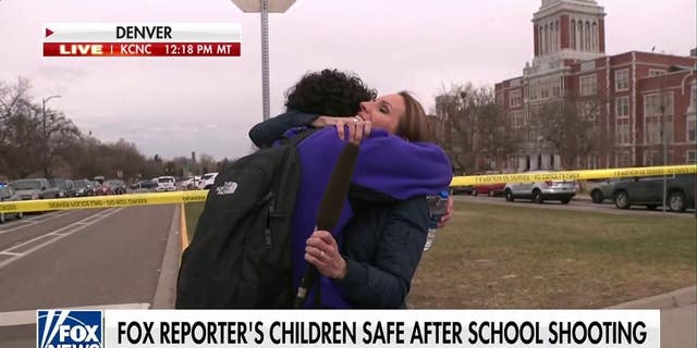 Fox News reporter Alicia Acuna reunites with her son following a shooting at his Denver school on March 22, 2023.