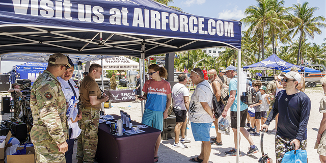 Air Force recruiters are seen at the Hyundai Air &amp; Sea Show in Miami Beach, Florida, in May 2022.