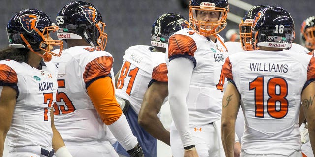 Albany Empire quarterback Tommy Grady, #4, with teammates before an Arena Football game between the Washington Valor and the Albany Empire on May 11, 2018, at Capital One Arena, in Washington, D.C.