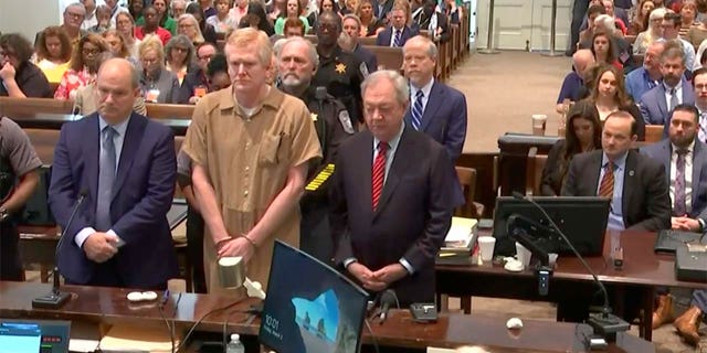 Alex Murdaugh stands with defense attorneys Jim Griffin and Dick Harpootlian during his sentencing at the Colleton County Courthouse in Walterboro, South Carolina on Friday, March 3, 2023. Murdaugh was found guilty of murdering his wife and son.