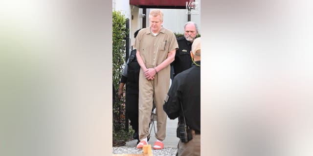 Alex Murdaugh is led out of the Colleton County courthouse in a tan prison jumpsuit.