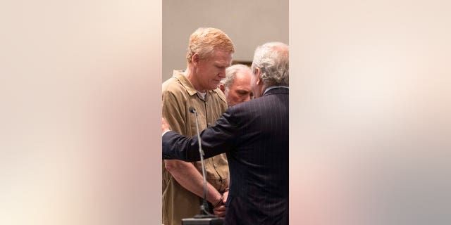 Defense attorney Dick Harpootlian talks with Alex Murdaugh while he is brought out of the courtroom during his sentencing at the Colleton County Courthouse in Walterboro on Friday, March 3, 2023 after he was found guilty on all four counts. 