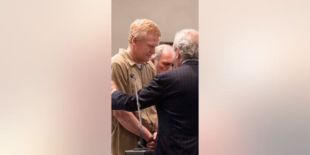 Defense attorney Dick Harpootlian talks with Alex Murdaugh while he is brought out of the courtroom during his sentencing at the Colleton County Courthouse in Walterboro on Friday, March 3, 2023 after he was found guilty on all four counts.