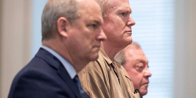Alex Murdaugh is sentenced to two consecutive life sentences for the murder of his wife and son as he's flanked by attorneys Jim Griffin, left, and Dick Harpootlian at the Colleton County Courthouse in Walterboro, S.C., on March 3, 2023.