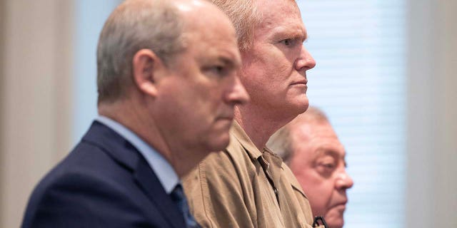 Alex Murdaugh is sentenced to two consecutive life sentences for the murder of his wife and son as he's flanked by attorneys Jim Griffin, left, and Dick Harpootlian at the Colleton County Courthouse in Walterboro, S.C., on March 3, 2023.