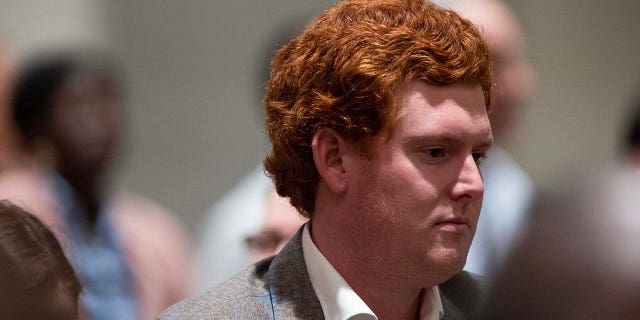 Buster Murdaugh, the son of Alex Murdaugh stands in the courtroom after his father Alex Murdaugh is found guilty on all counts for the murder of his wife and son at the Colleton County Courthouse on Thursday, March 2, 2023. 