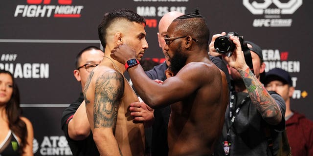 Alex Perez, left, and Manel Kape face off during the ceremonial weigh-in for UFC Fight Night at the AT&T Center on March 24, 2023 in San Antonio.