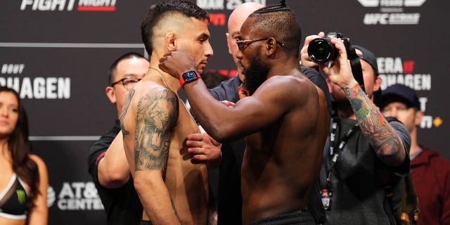 Alex Perez, left, and Manel Kape face off during the UFC Fight Night ceremonial weigh-in at AT&T Center on March 24, 2023 in San Antonio.