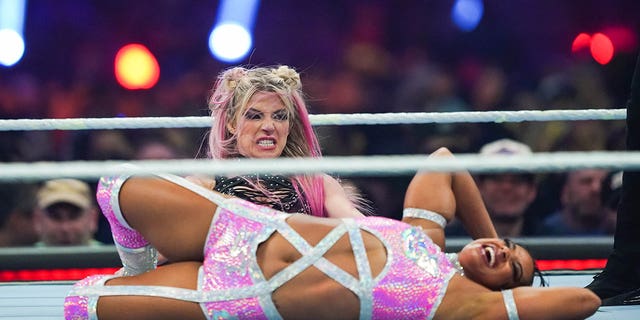 Bianca Belair, bottom, and Alexa Bliss wrestle during the Raw Women's championship during the WWE Royal Rumble at the Alamodome on Jan. 28, 2023 in San Antonio.
